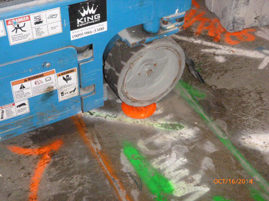 Hartman Dome HHD-2.5-3.5 installed in floor with heavy machinery on top of it, demonstrating weight bearing feature of the hole covers, image 9