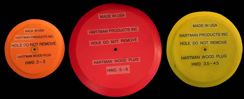 Hartman Wood Hole Plugs, top view of the 3 color-coded hole cover kits. Each fits 3 specific hole sizes, totaling 9 pre-cut sizes.